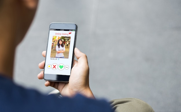 Online dating,scam concept.Man hands using smart phone
