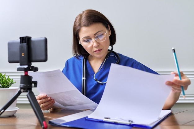 Online doctor consultation female talking with patient using video call