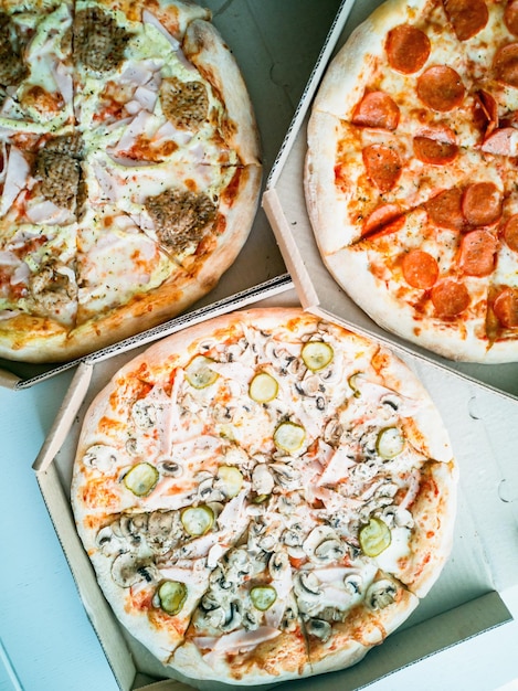 Photo online food ordering and food delivery pizza in boxes