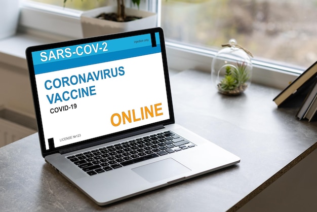 online health appointment, booking or reserve coronavirus or covid-19 vaccine in concept social distance healthcare in quanrantine people at home using laptop computer.