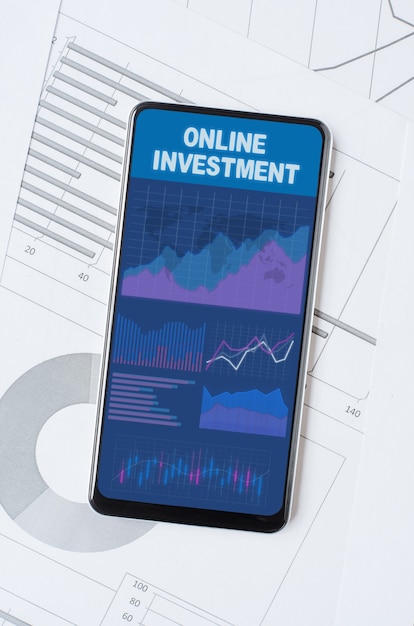 Online investment. Smartphone with a mobile app