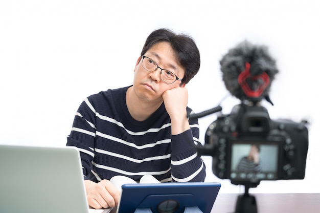 Online learning concept. An Asian middle-aged male teacher preparing to learn online.