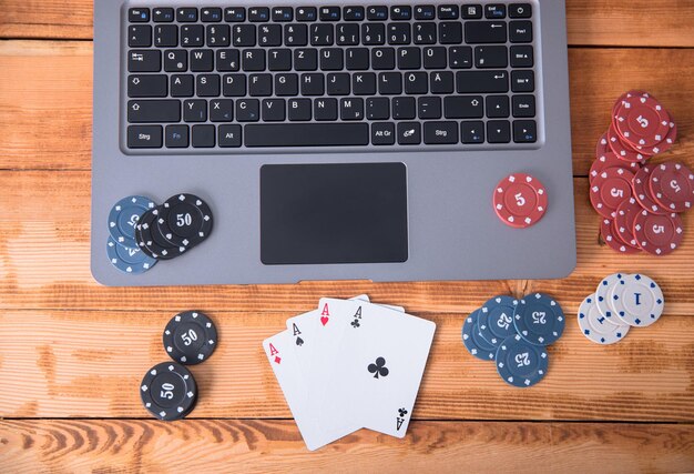 Online poker with laptop and chips