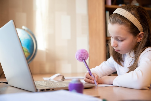 Online remote learning school kid with computer having video\
conference chat with teacher and class group teenager studying from\
home homeschooling distant learning