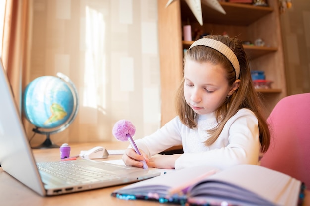 Online remote learning school kid with computer having video\
conference chat with teacher and class group teenager studying from\
home homeschooling distant learning