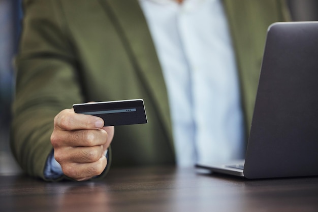 Online shopping credit card and hands of businessman with laptop for ecommerce payment and fintech Digital finance stock market and male with computer for business budget investment and banking