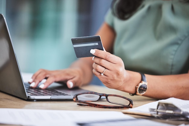 online shopping credit card and woman hands with laptop for ecommerce payment and purchase on internet store technology fintech and girl typing banking details on computer for online banking