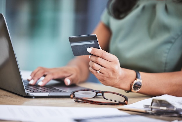 Photo online shopping credit card and woman hands with laptop for ecommerce payment and purchase on internet store technology fintech and girl typing banking details on computer for online banking