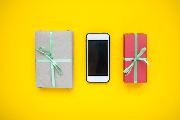 Online shopping Phone and wrapped boxes with gifts