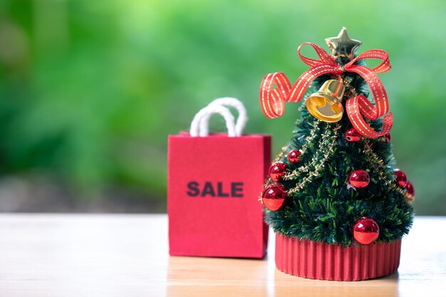 Online shopping and shopping bags delivery service Miniature Christmas tree