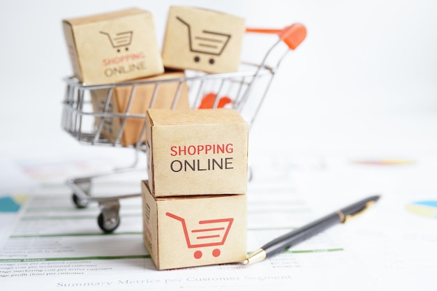 Online shopping Shopping cart box on business graph import export finance commerce