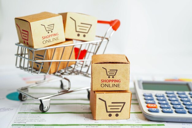 Online shopping Shopping cart box on calculator import export finance commerce