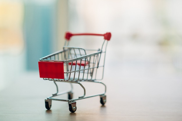 Photo online shopping through a shopping cart. - image