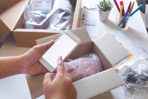 online shopping with young female buying products and using a smartphone