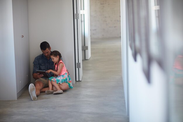 Online for some entertainment Shot of a father and daughter spending time together at home