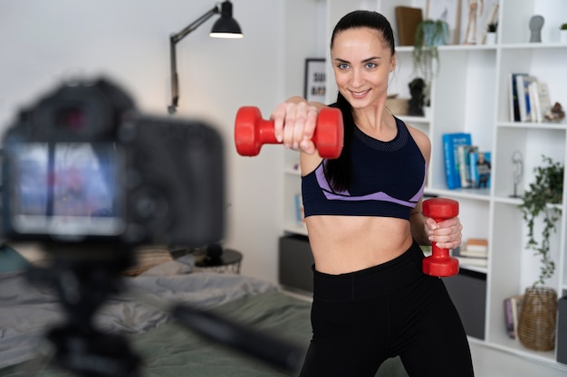 Online sport fitness instructor recording her session