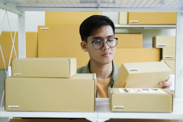 Online store owner checking orders for packaged product