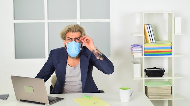 Online training and classes Respiratory hazards are common in workplace man working on distance in home office Without personal contact making business online coronavirus quarantine