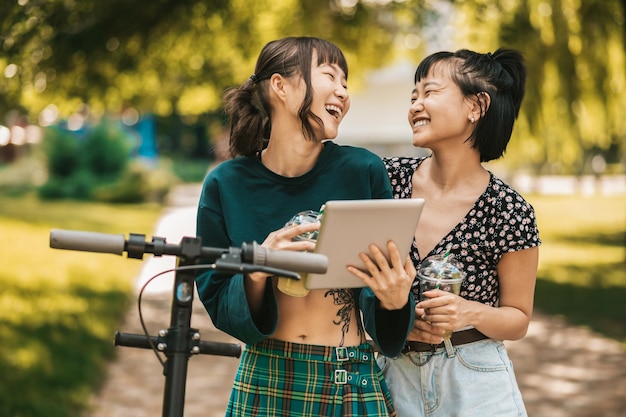 Online. Two girls watching photos online and looking involved