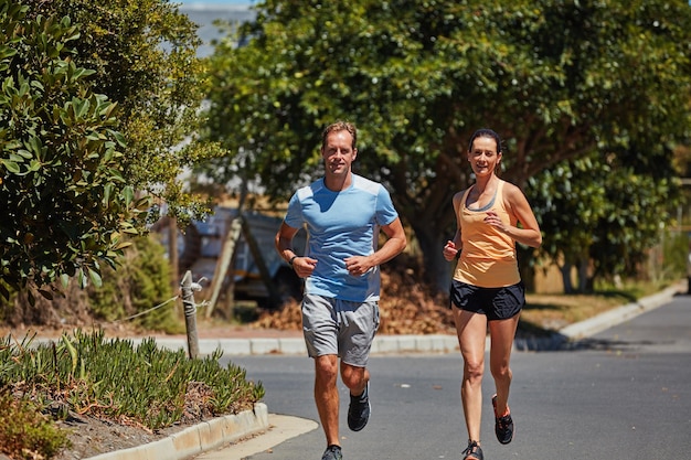 The only bad workout is the one you didnt do Shot of a happy couple jogging together in their neighborhood
