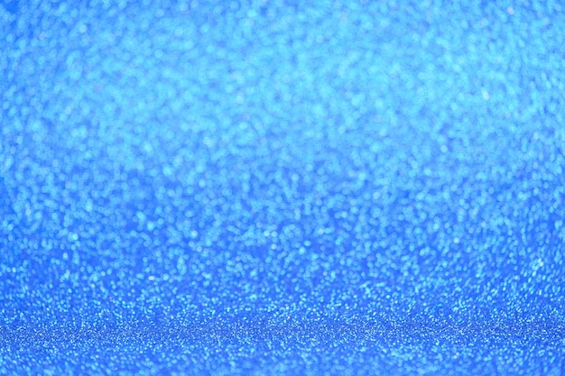 Ontfocuste blauwe abstracte textuur glitter achtergrond