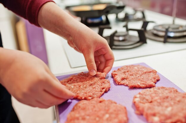 Ð¡ooking burgers in the kitchen at home during quarantine time.