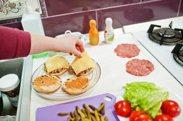 Ð¡ooking burgers in the kitchen at home during quarantine time.