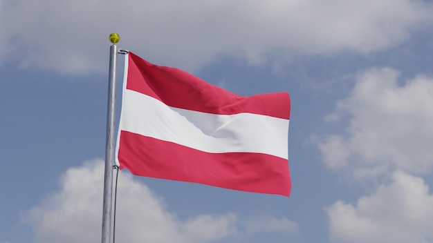 Foto oostenrijkse vlag zwaaiend op een vlaggenpaal achtergrond hemel met wolken