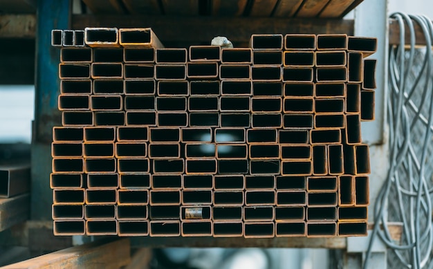 Photo open-air market of steel products in the city. a lot of different building material from iron . pipes and tubes .