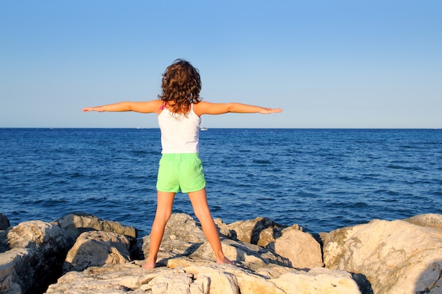 Open arms girl looking blue ocean sea feel freedom