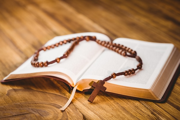 Open bible with rosary beads