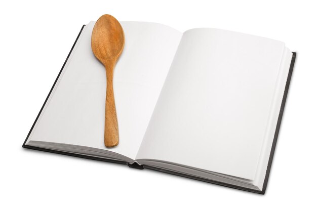 Open blank notebook  and wooden spoon on a white background