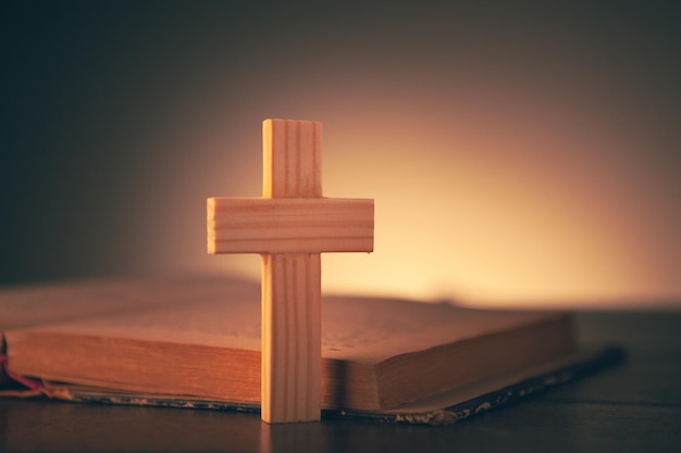 Open book and cross on the table