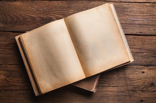 open book on old wooden table