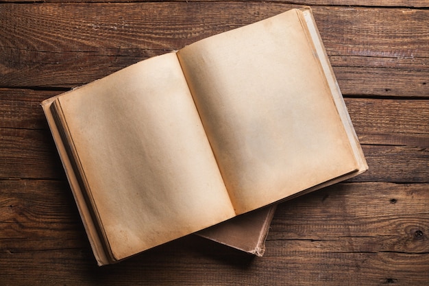 Open book on old wooden table