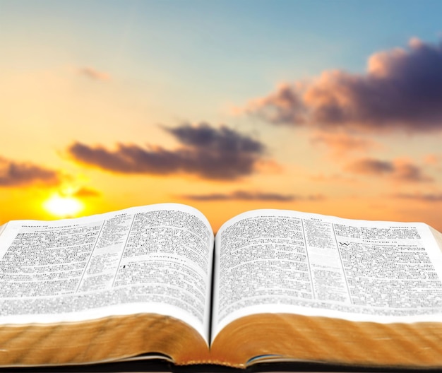 Open book on old wooden table