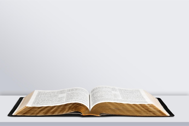 Open book on old wooden table