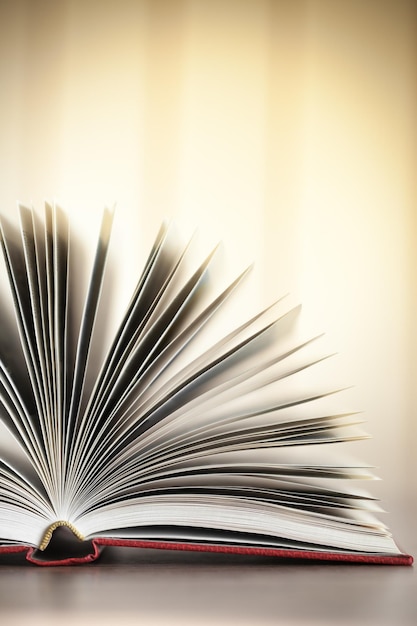 Open book on old wooden table