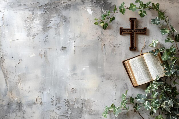 An open book sitting on top of a table next to a cross