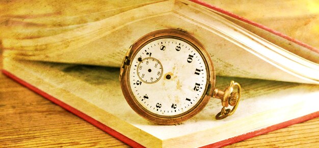 an open book with blank pages on wood table