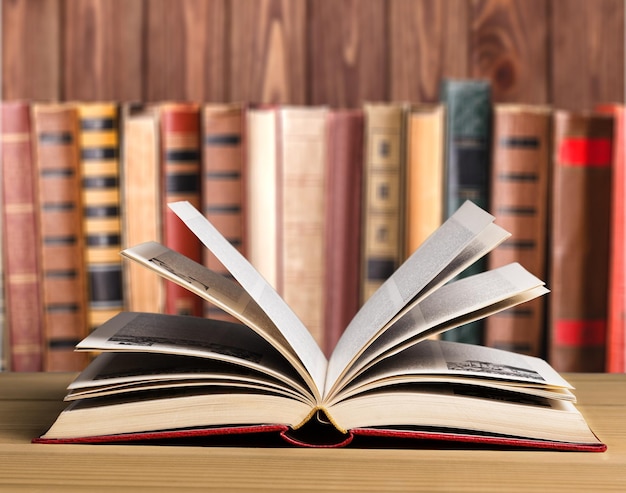 Open book on wooden table