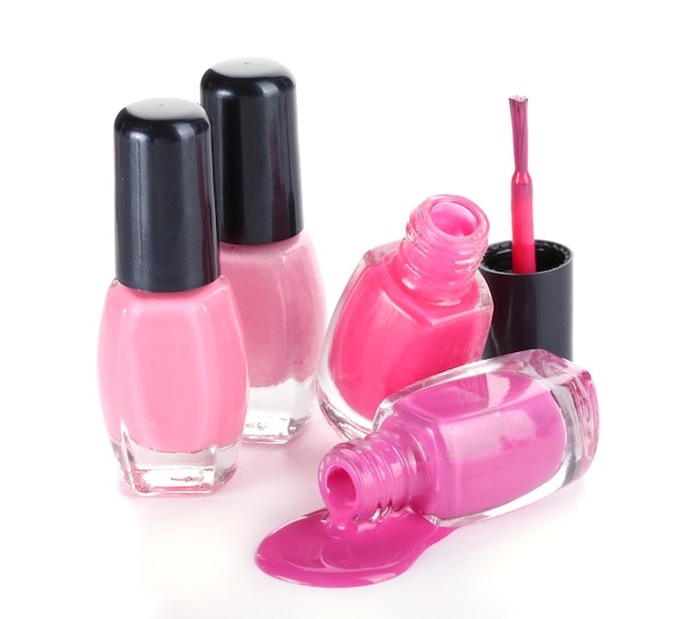 Open bottles with bright nail polish isolated on white