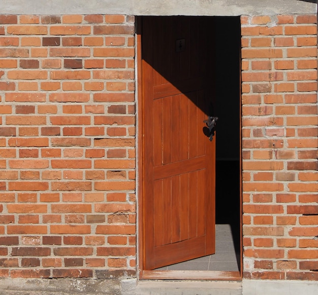 Open door in brick wall