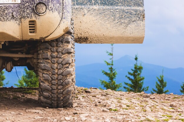 Open door car at the top of the mountain. Traveling in the mountains by car