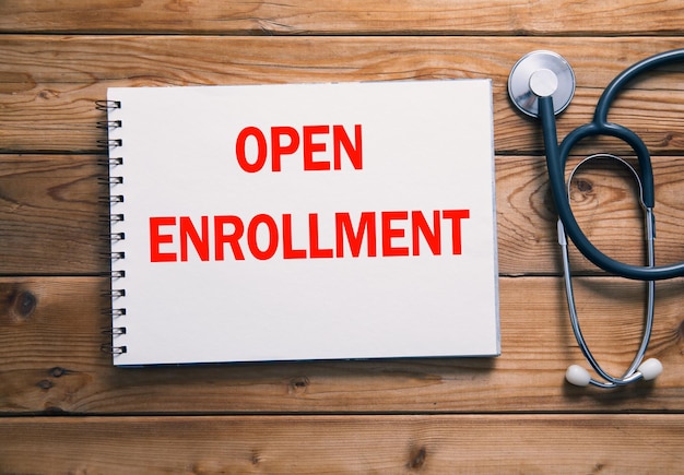 Open enrollment on paper and stethoscopexA