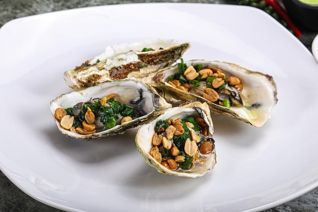 Open half oysters with green onion