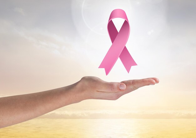 Open hand with pink ribbon for breast cancer awareness