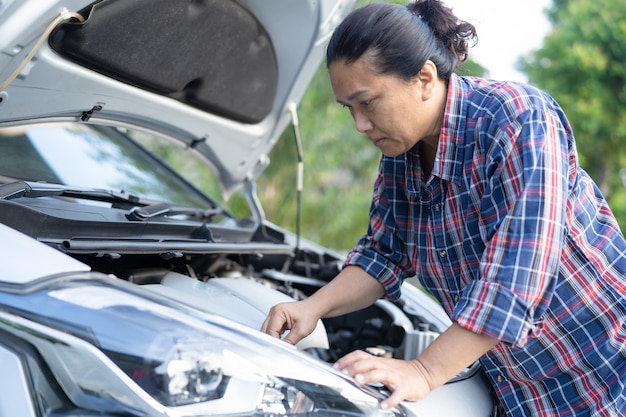 Open hood mechanic engine system to check and repair damage car crash