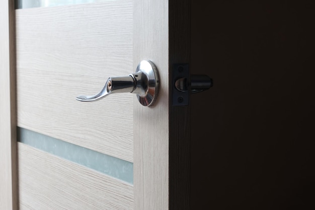 Open interior door to bedroom illuminated by daylight.