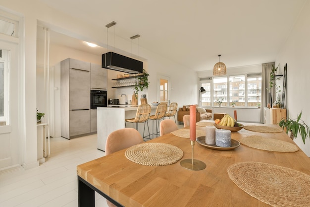 An open kitchen and dining room with a wooden table